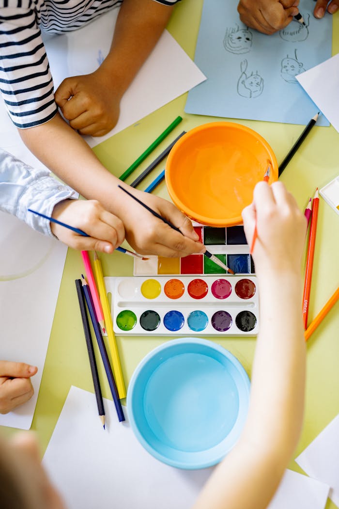 Kids enjoying watercolor painting, enhancing creativity and learning in a fun environment.